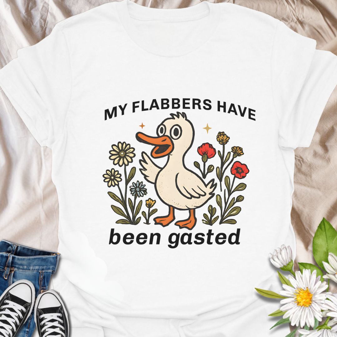 Add a splash of humor to your wardrobe with this quirky “My Flabbers Have Been Gasted” t-shirt featuring an adorable duck and whimsical flowers. A hilarious conversation starter and perfect gift for pun lovers, meme fans, or anyone who appreciates playful and unexpected expressions.