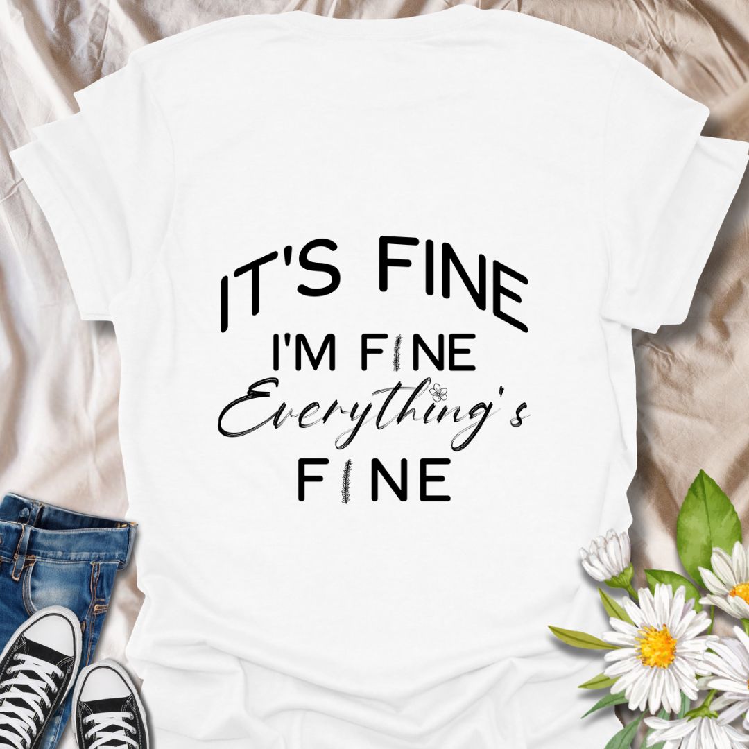 Keep it together (barely) with this humorous “It’s Fine. I’m Fine. Everything’s Fine” t-shirt. A relatable design with playful typography and a subtle floral touch—perfect for those who handle chaos with a smile.