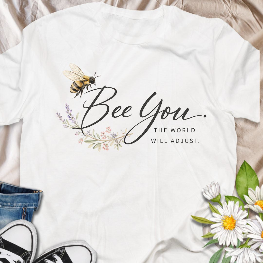 Bee You, the world will adjust. This inspirational bee and botanical t-shirt celebrates self-confidence, authenticity, and nature-led living. A thoughtful gift for bee lovers, plant lovers, and anyone who believes in staying true to themselves.