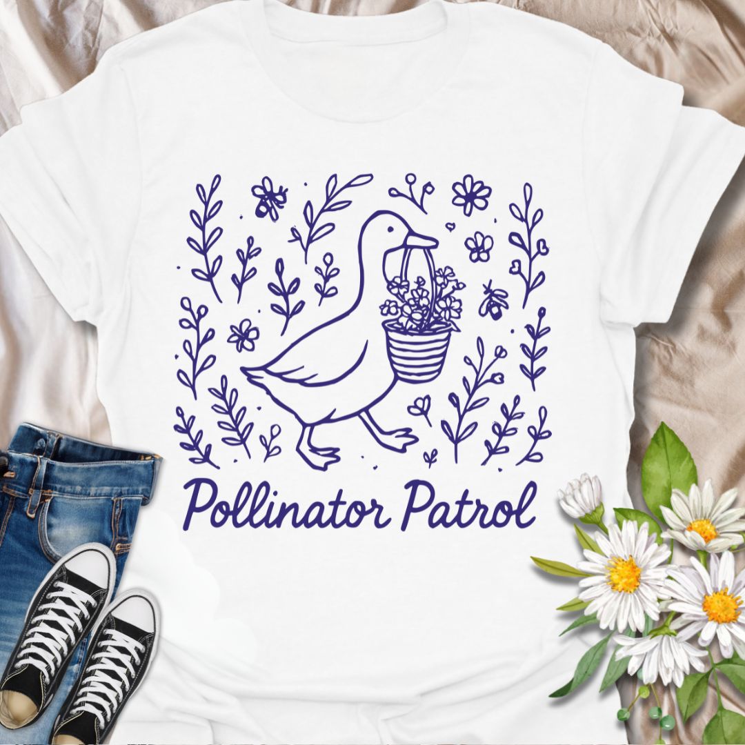 Charming ‘Pollinator Patrol’ goose shirt featuring a goose carrying flowers surrounded by bees and blooms. Perfect for gardeners, beekeepers, and wildlife conservation enthusiasts