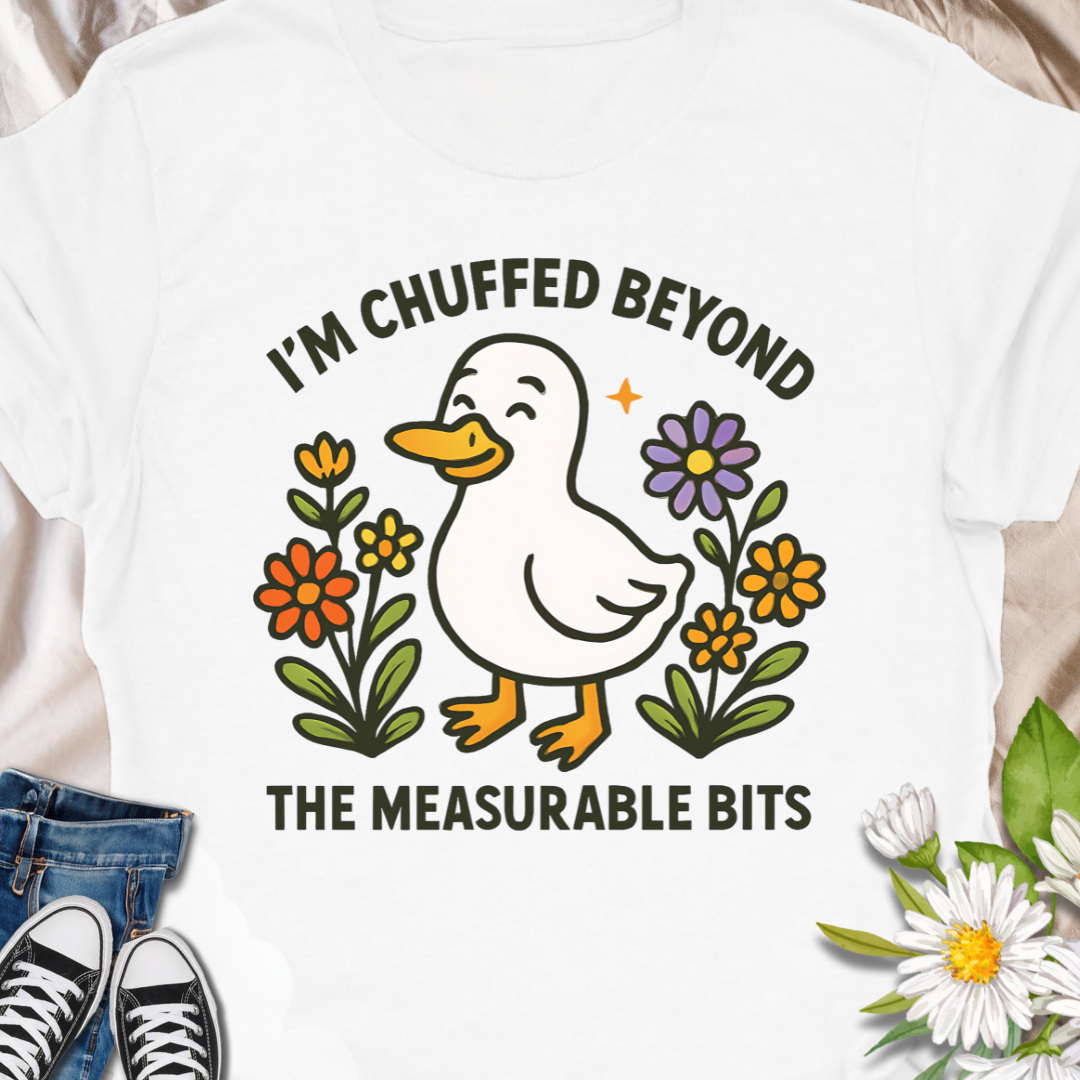 Soft, light, and quietly silly — this tee carries a tiny moment of honest feeling. A cheerful duck illustration stands among simple hand-drawn flowers with the line “I have reached critical dither levels.” Wear it when your brain is doing cartwheels and you need an outfit that says, with humor and a little compassion, “I’m wobbling but still okay.”