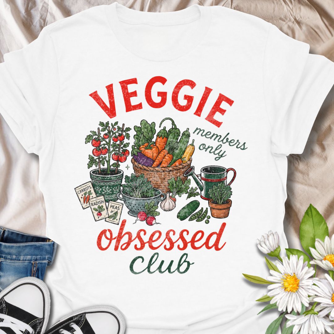 This Veggie Obsessed Club t-shirt is perfect for gardeners, vegetable lovers, and homegrown food fans. Featuring a colorful illustrated harvest scene with tomatoes, carrots, cucumbers, seed packets, and a watering can, this fun gardening tee is great for anyone who loves growing their own food and spending time in the garden.