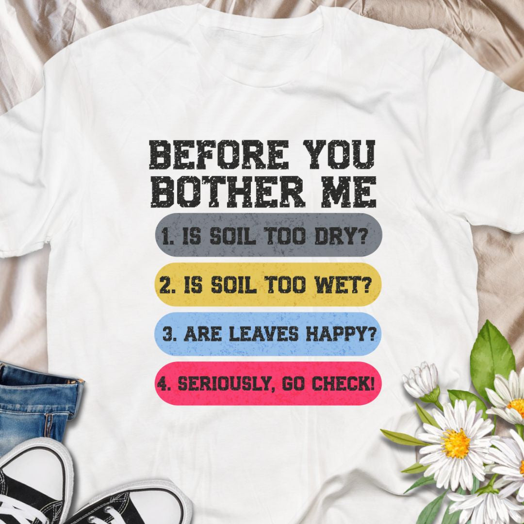 This tee speaks with a wry, green-thumbed voice. The front print lists a gardener’s quick checklist — soil too dry? too wet? are the leaves happy? — finished with a bright, humorous nudge to “go check.” The t-shirt carries a playful, knowledgeable tone that fellow plant lovers will recognize and laugh at.