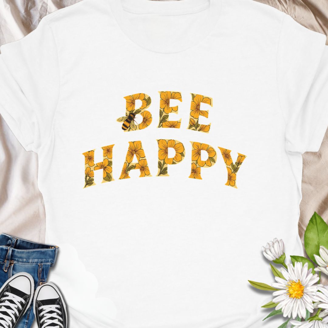 Spread positivity and nature-loving vibes with this charming “Bee Happy” t-shirt, featuring sunflower-filled typography and a playful bee motif. Perfect for beekeepers, garden lovers, and anyone who appreciates cheerful, nature-inspired fashion. A great gift for pollinator advocates and flower enthusiasts.