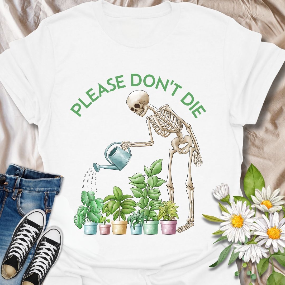 Funny plant lover t-shirt featuring a skeleton watering houseplants with the phrase 'Please don't die.' A dark humor gardening tee perfect for plant parents, indoor jungle fans, and anyone with a green thumb and a sense of humor. Great gift for plant moms, goth gardeners, and sarcastic plant enthusiasts. White