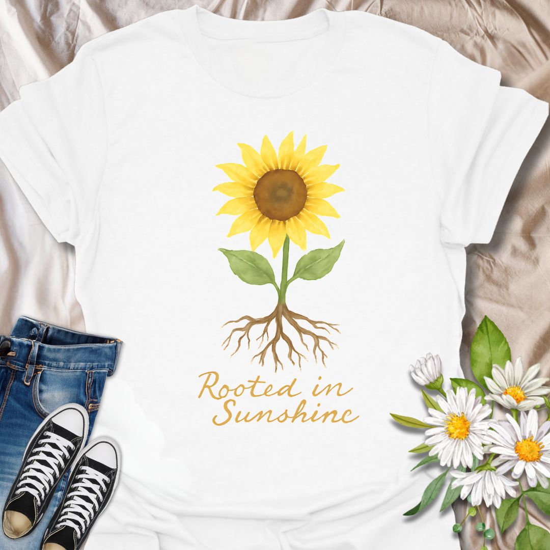 Uplifting sunflower t-shirt with detailed roots and the inspiring phrase ‘Rooted in Sunshine.’ Perfect for nature lovers, gardeners, plant moms, and anyone who finds strength and joy in growth, positivity, and sunshine. A thoughtful gift for self-care, mindfulness, and outdoor enthusiasts.