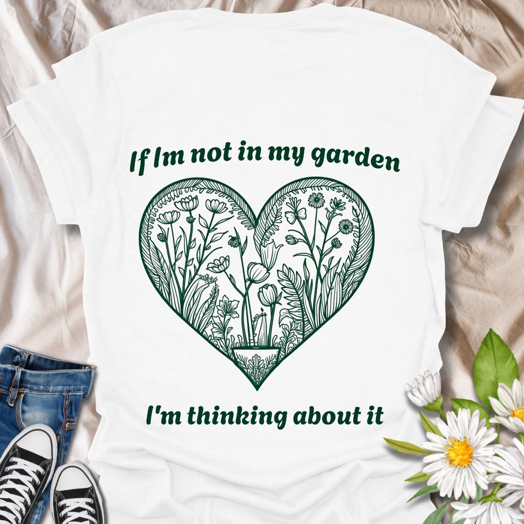 Show off your gardening passion with this beautifully illustrated heart-shaped floral design. Featuring the phrase “If I'm not in my garden, I'm thinking about it,” this shirt is perfect for plant lovers who dream of dirt, blooms, and backyard bliss.