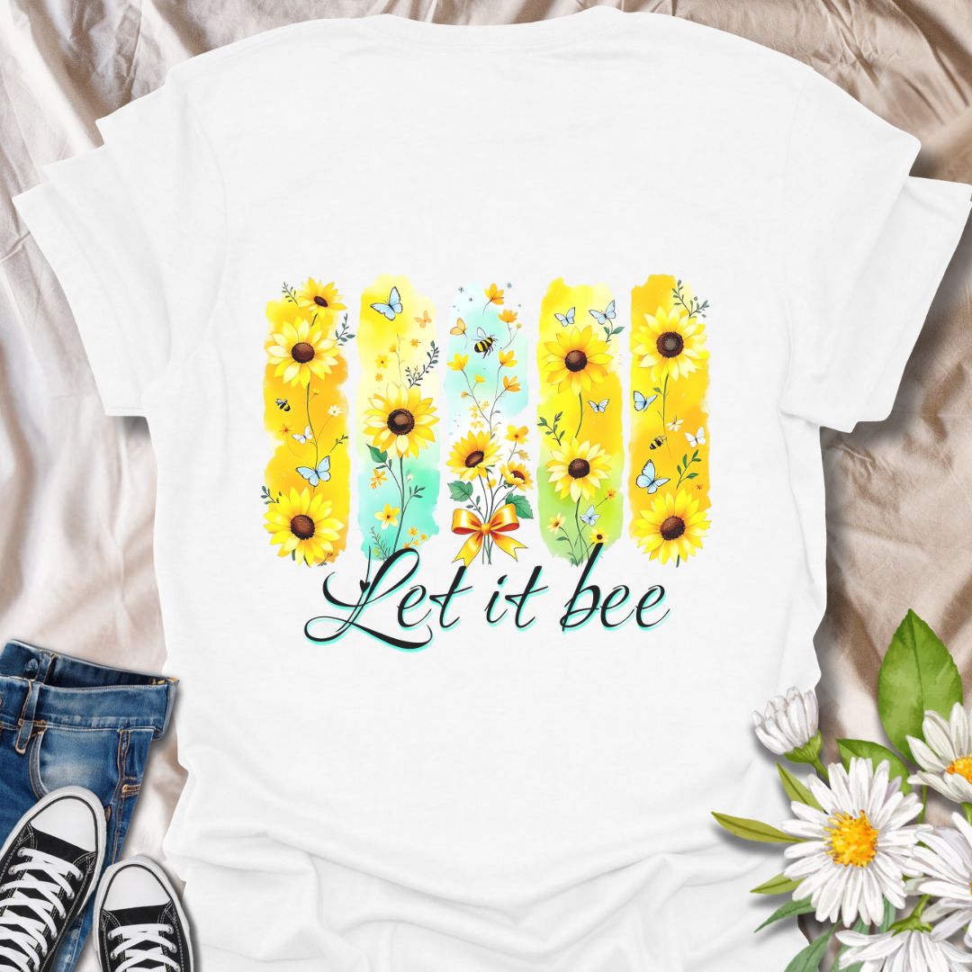 Bright sunflower t-shirt with bees and butterflies and the playful phrase "Let it bee." Perfect for nature lovers, bee enthusiasts, gardeners, and wildflower fans who appreciate pollinators. Fun spring and summer tee celebrating positivity and nature’s beauty. White