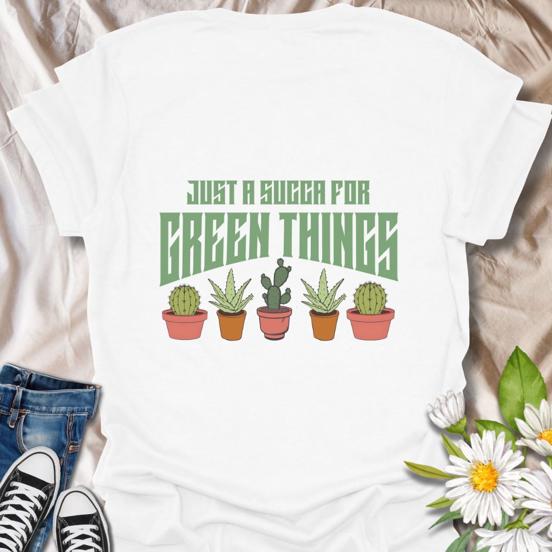 Embrace your love for all things leafy with this playful “Just a Succa for Green Things” t-shirt. Featuring a lineup of adorable potted succulents and bold retro typography, it’s perfect for plant lovers with a sense of humor.