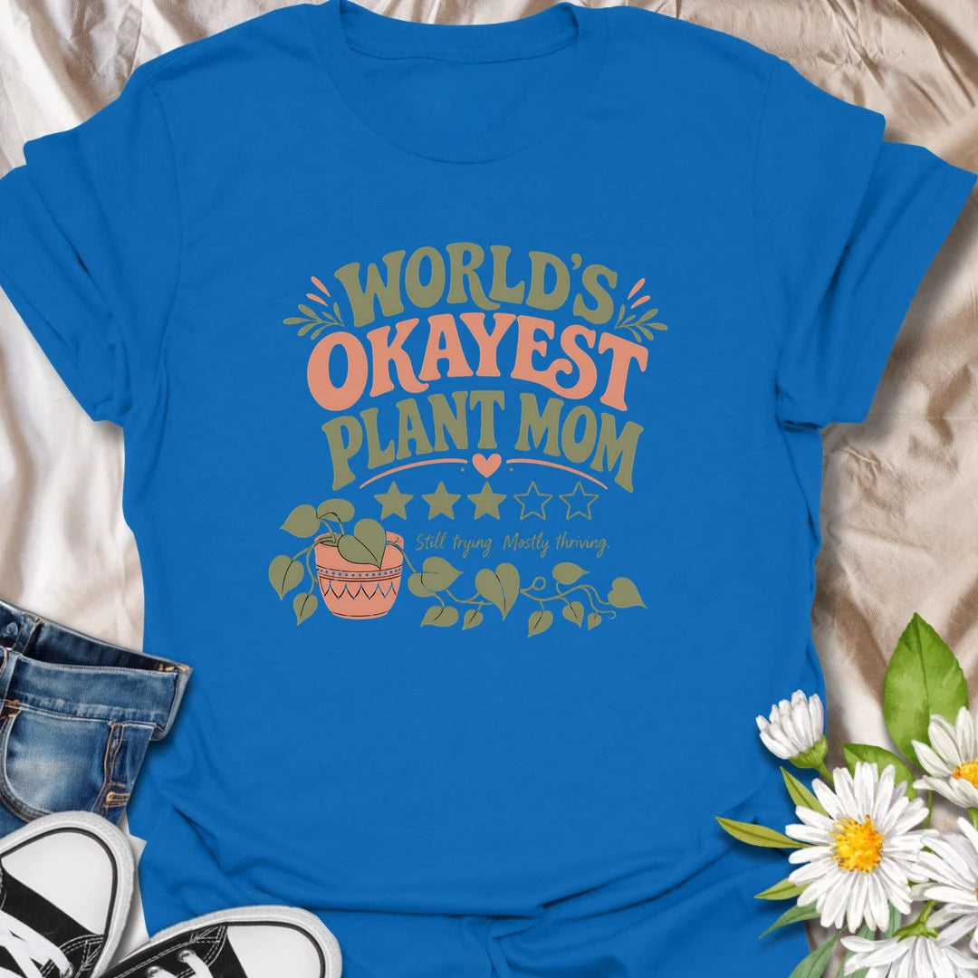 Celebrate imperfect plant parenting with this funny “World’s Okayest Plant Mom” T-shirt. Featuring a playful three-star rating, trailing houseplant, and the phrase “Still Trying, Mostly Thriving,” it is perfect for plant lovers who do their best without taking plant care too seriously. A fun gift for houseplant moms, indoor gardeners, and proudly average green thumbs.