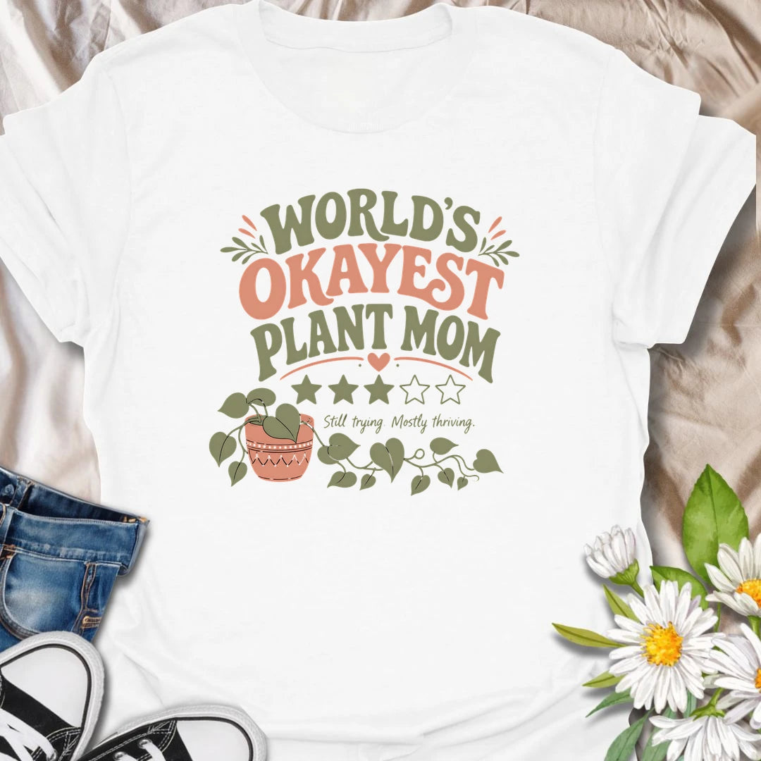 Celebrate imperfect plant parenting with this funny “World’s Okayest Plant Mom” T-shirt. Featuring a playful three-star rating, trailing houseplant, and the phrase “Still Trying, Mostly Thriving,” it is perfect for plant lovers who do their best without taking plant care too seriously. A fun gift for houseplant moms, indoor gardeners, and proudly average green thumbs.